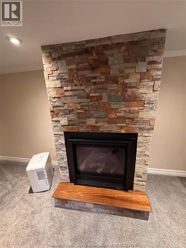 1527 Pierre, Windsor, ON - Indoor Photo Showing Living Room With Fireplace