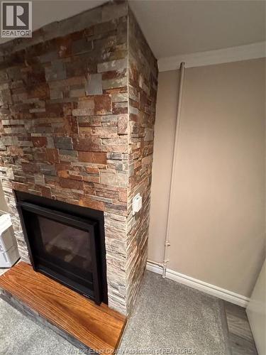 1527 Pierre, Windsor, ON - Indoor Photo Showing Other Room With Fireplace