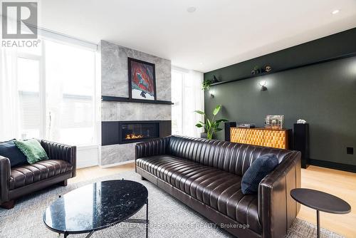Built-in gas fireplace. - 330 Kenwood Avenue, Ottawa, ON - Indoor Photo Showing Living Room With Fireplace
