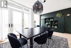 Dining area with walkout to balcony. - 