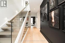 Main level foyer leads to familyroom/den. - 