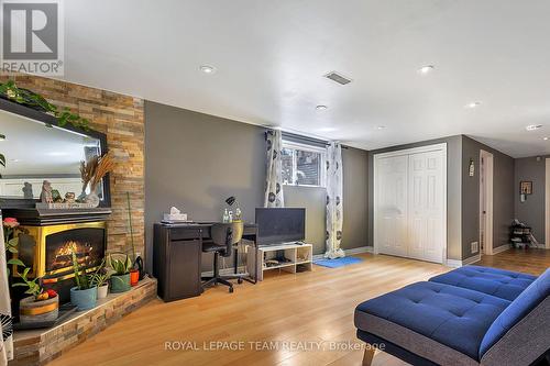 Lower Unit Living Area - 925 Moorvale Street, Ottawa, ON - Indoor With Fireplace