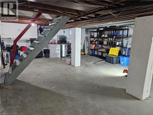 Lower level featuring exposed ceiling joists and a concrete floor - 75 Barons Avenue S, Hamilton, ON - Indoor Photo Showing Basement