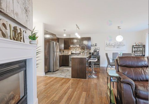Salon - 205-10 Rue Des Manoirs, Charlemagne, QC - Indoor With Fireplace