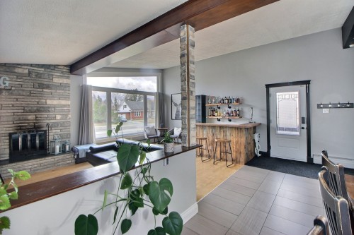 Salon - 22 6E Avenue E., Amos, QC - Indoor With Fireplace