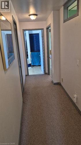 Carpeted hallway upstairs - 257 Cedar Street, Simcoe, ON - Indoor Photo Showing Other Room