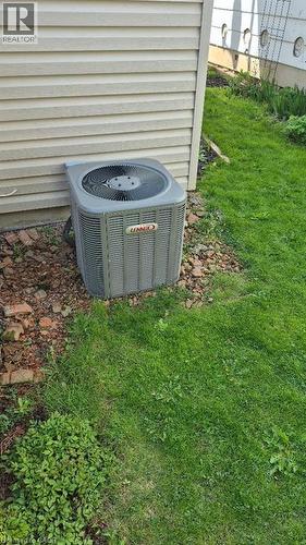 Lennox air conditioning unit situated alongside vinyl siding - 257 Cedar Street, Simcoe, ON - Outdoor