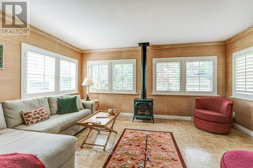 Family room with gas stove and California shutters - 103 Queen Street, St. Catharines (Downtown), ON - Indoor Photo Showing Living Room With Fireplace