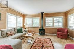 Family room with gas stove and California shutters - 