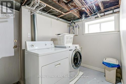 LLl laundry with access to stairs to backyard - 103 Queen Street, St. Catharines (Downtown), ON - Indoor Photo Showing Laundry Room