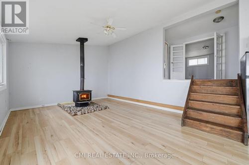 100 Alsops Beach Road, Brock, ON - Indoor Photo Showing Other Room With Fireplace