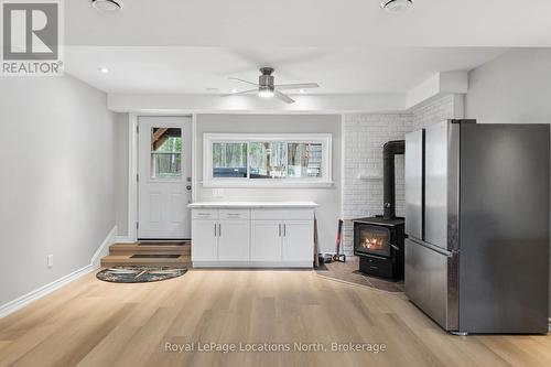 93 Ronald Avenue, Tiny, ON - Indoor With Fireplace