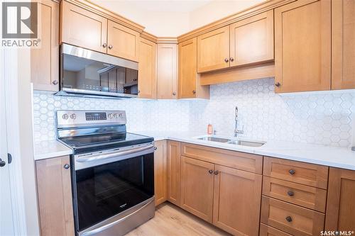 143 615 Stensrud Road, Saskatoon, SK - Indoor Photo Showing Kitchen With Double Sink