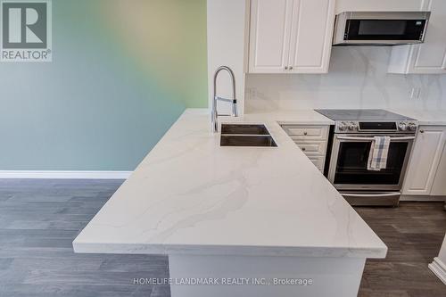 317 - 9017 Leslie Street, Richmond Hill, ON - Indoor Photo Showing Kitchen With Double Sink With Upgraded Kitchen