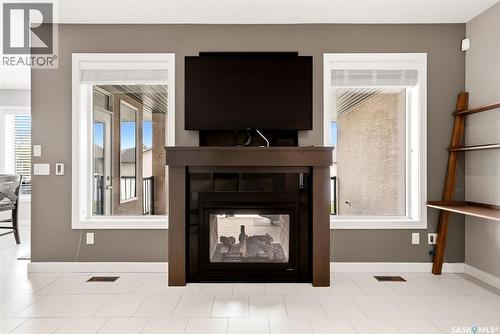 4151 Chuka Drive, Regina, SK - Indoor Photo Showing Living Room With Fireplace