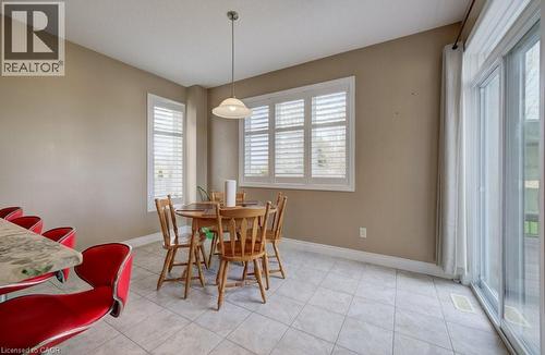 Dining area featuring tiled flooring and a sliding glass door - 331 Westpark Crescent Unit# Upper, Waterloo, ON - Indoor Photo Showing Dining Room