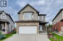Two-story residence featuring a brick and siding exterior, an attached garage, and a concrete driveway - 331 Westpark Crescent Unit# Upper, Waterloo, ON  - Outdoor With Facade 