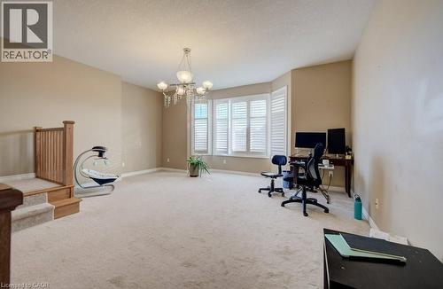 Spacious room featuring neutral carpeting and light beige wall paint - 331 Westpark Crescent Unit# Upper, Waterloo, ON - Indoor Photo Showing Gym Room