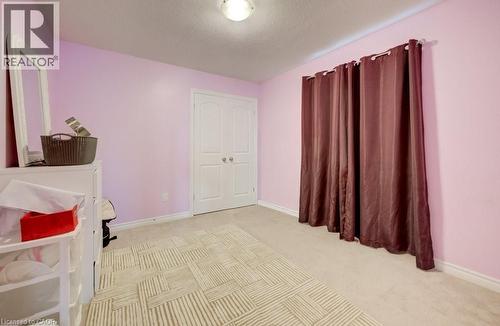 Wall-to-wall carpeting with a decorative area rug - 331 Westpark Crescent Unit# Upper, Waterloo, ON - Indoor