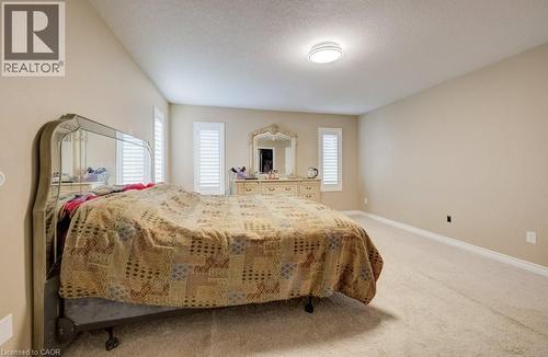 Spacious room featuring neutral carpeting and light-colored walls - 331 Westpark Crescent Unit# Upper, Waterloo, ON - Indoor Photo Showing Bedroom