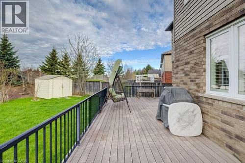 Expansive rear deck featuring wood-finish flooring and black metal railings - 331 Westpark Crescent Unit# Upper, Waterloo, ON - Outdoor With Deck Patio Veranda