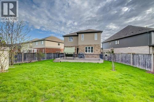 Expansive green lawn with a privacy fence - 331 Westpark Crescent Unit# Upper, Waterloo, ON - Outdoor With Backyard With Exterior