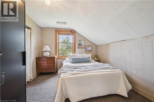 Carpeted room with a pitched ceiling and a wood-framed window - 630 Robert Ferrie Drive, Kitchener, ON - Indoor Photo Showing Bedroom