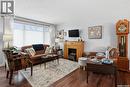 95 Schneider Crescent, Regina, SK  - Indoor Photo Showing Living Room With Fireplace 