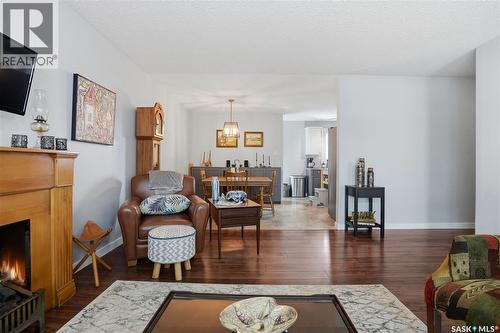 95 Schneider Crescent, Regina, SK - Indoor Photo Showing Living Room With Fireplace