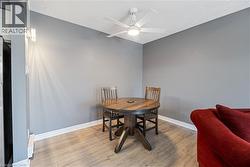 Recessed wall sconce lighting complements the overhead ceiling fan with integrated illumination - 
