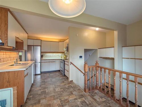 34 Clement Drive, Brandon, MB - Indoor Photo Showing Kitchen With Double Sink