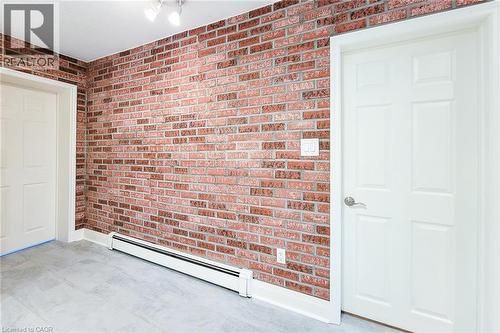 Entrance to both main floor bedrooms with ensuite baths. - 156 Park Row S, Hamilton, ON - Indoor Photo Showing Other Room