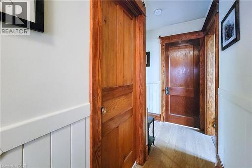 Hallway with wainscoting and wood finished floors - 156 Park Row S, Hamilton, ON - Indoor Photo Showing Other Room