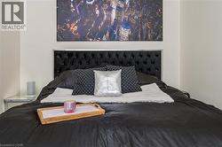 Tufted fabric headboard with a metallic trim - 