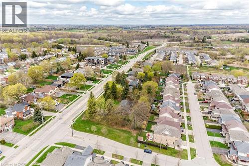 Aerial view of a residential area featuring established neighborhoods, newer housing developments, and surrounding green spaces - 355 Guelph Avenue, Cambridge, ON 
