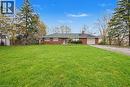 Expansive front lawn with mature trees and a long gravel driveway - 355 Guelph Avenue, Cambridge, ON 
