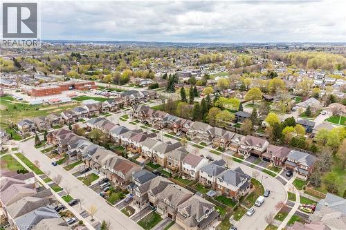 Aerial perspective showcasing a residential neighborhood with tree-lined streets and varied architectural styles - 355 Guelph Avenue, Cambridge, ON 