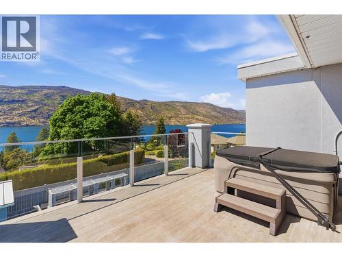 Front sun deck-connects to the second level/primary bedroom with a hot tub for evening relaxation - 2090 Bennett Road, Kelowna, BC - Outdoor With Body Of Water With Deck Patio Veranda With Exterior