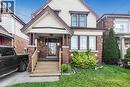 Brick and siding exterior with a covered front porch featuring square columns - 114 Weir Street N, Hamilton, ON  - Outdoor 