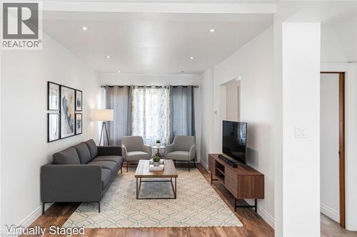 Virtually staged - 114 Weir Street N, Hamilton, ON - Indoor Photo Showing Living Room
