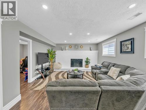 3474 Deerbrook, Windsor, ON - Indoor Photo Showing Living Room With Fireplace