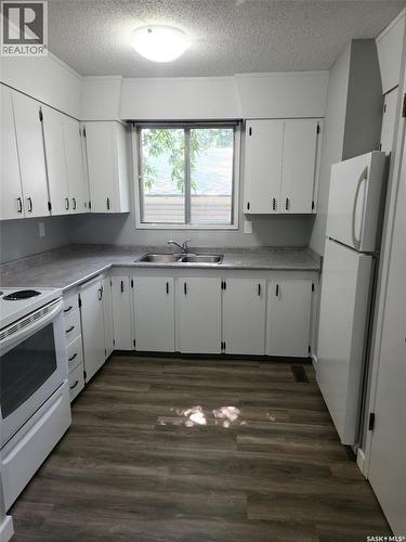 3615-3617 Fairlight Drive, Saskatoon, SK - Indoor Photo Showing Kitchen With Double Sink