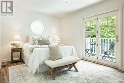 Primary Bedroom w/ Balcony - 