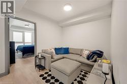 Recessed living area with light wood-finish flooring - 