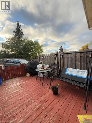 Expansive outdoor deck area featuring wood decking and a privacy fence - 181 Thaler Avenue, Kitchener, ON 