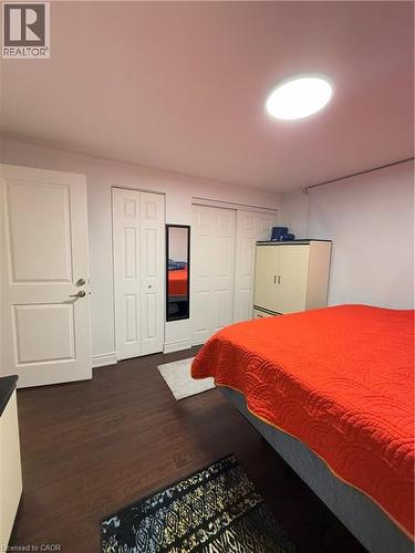 Wood-finish flooring present throughout, complemented by white baseboards - 181 Thaler Avenue, Kitchener, ON 