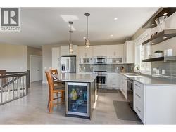 Beautiful kitchen with stainless steel appliances and quartz counters - 