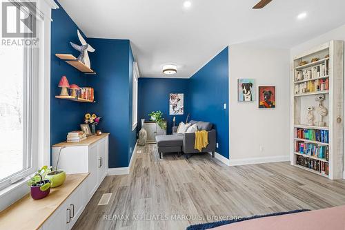 Seating area in primary bedroom. - 4421M Old Kingston Road, Rideau Lakes, ON 
