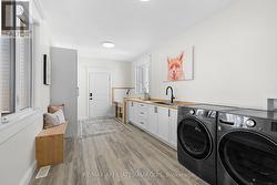 Mudroom with dog wash station & laundry - 