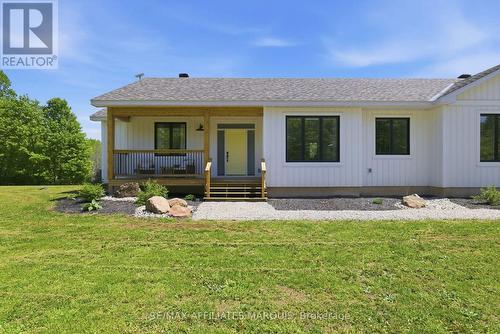 With a front porch made for morning coffee. - 4421M Old Kingston Road, Rideau Lakes, ON 